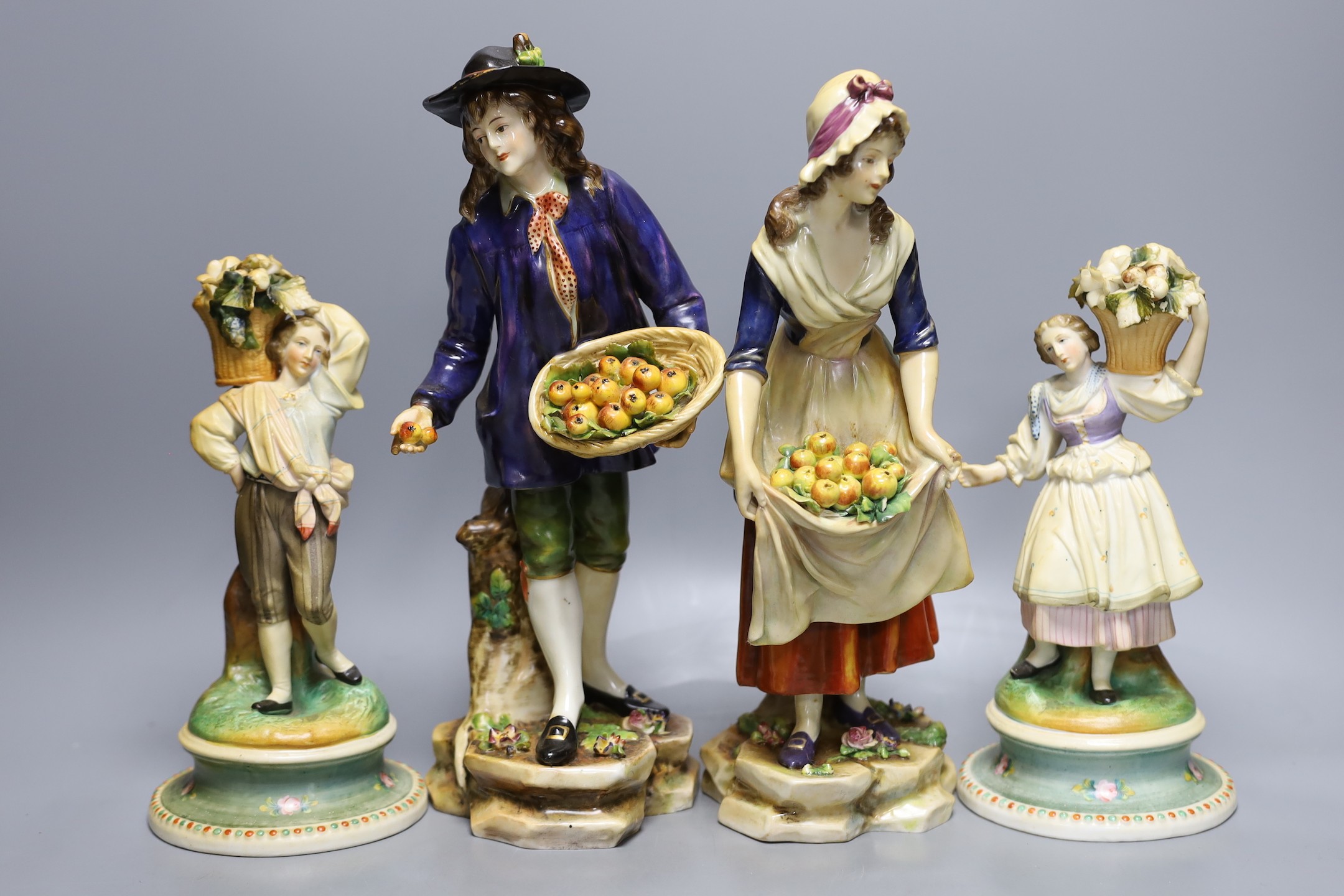 Two pairs of Continental porcelain figures, tallest 30cm